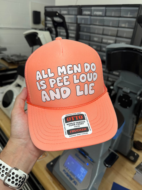 All Men Do Is Pee Loud A& Lie Trucker Hat